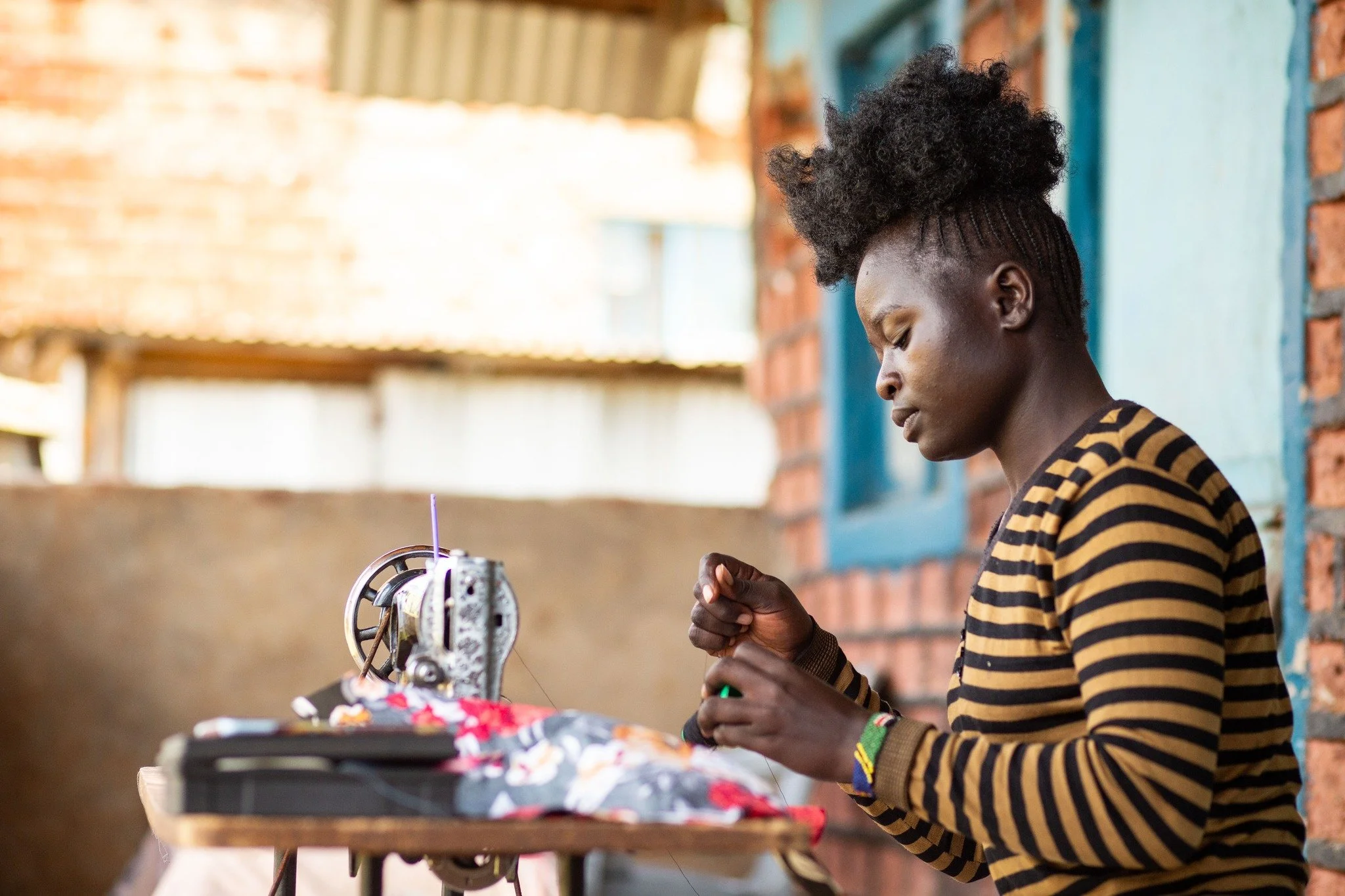 Imagine you had to choose between giving your daughter an education and putting food on the table. 

Raised by a single mother, Naomi grew up in extreme material poverty in a one-room home without electricity or running water. She had to drop out of 