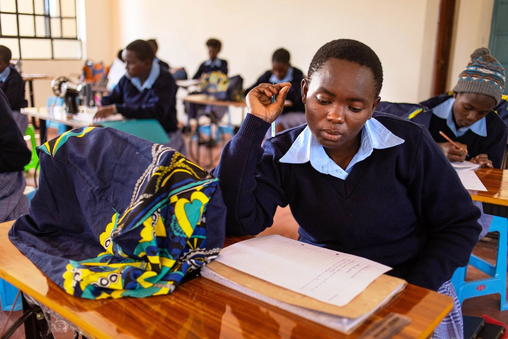 As our students prepare for their national dressmaking exams, they also study English and some basic computer skills. This knowledge is incredibly valuable for them as they prepare for graduating from Neema and finding employment. While most alumni w