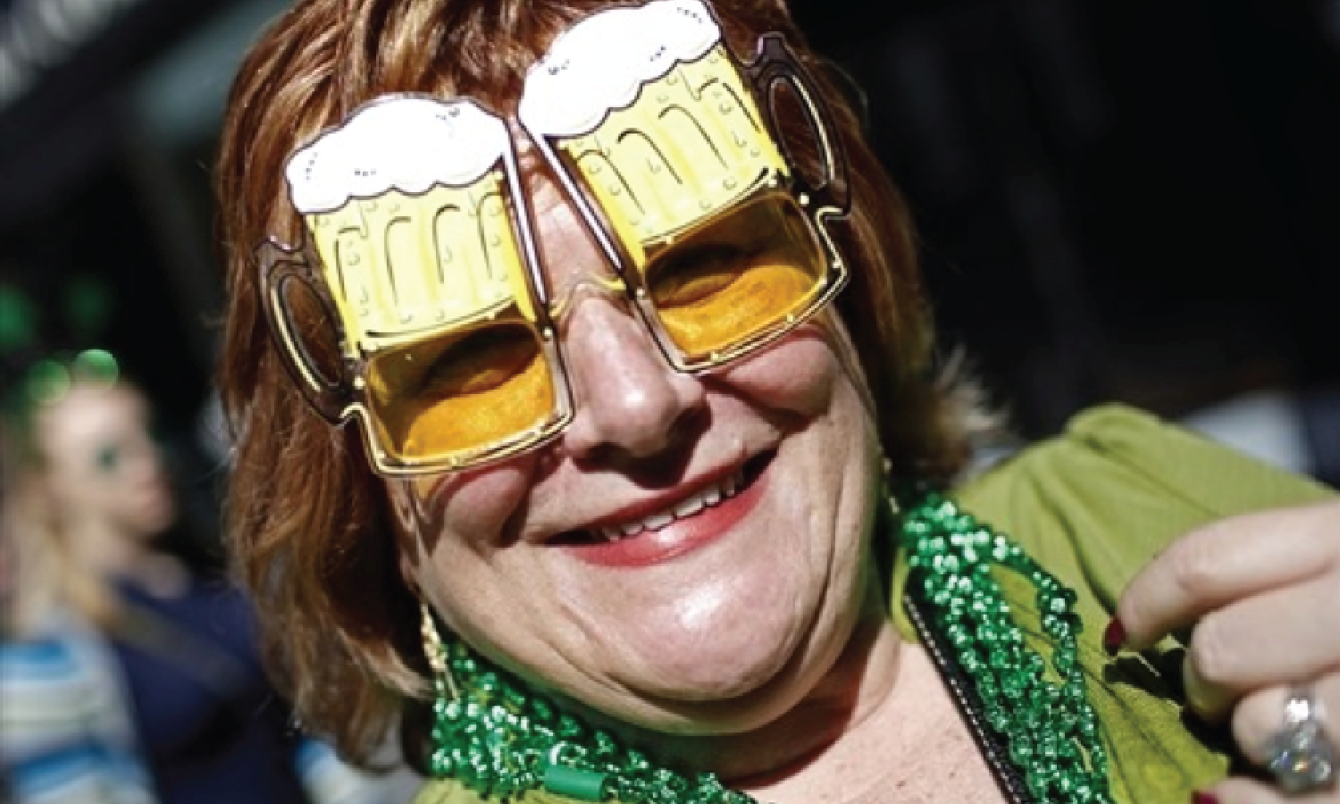 A woman wears beer mug glasses as she joins thousands celebrating along 5th Avenue in New York during the city's 250th annual St. Patrick's Day parade on March 17, 2011. Mike Segar / Reuter