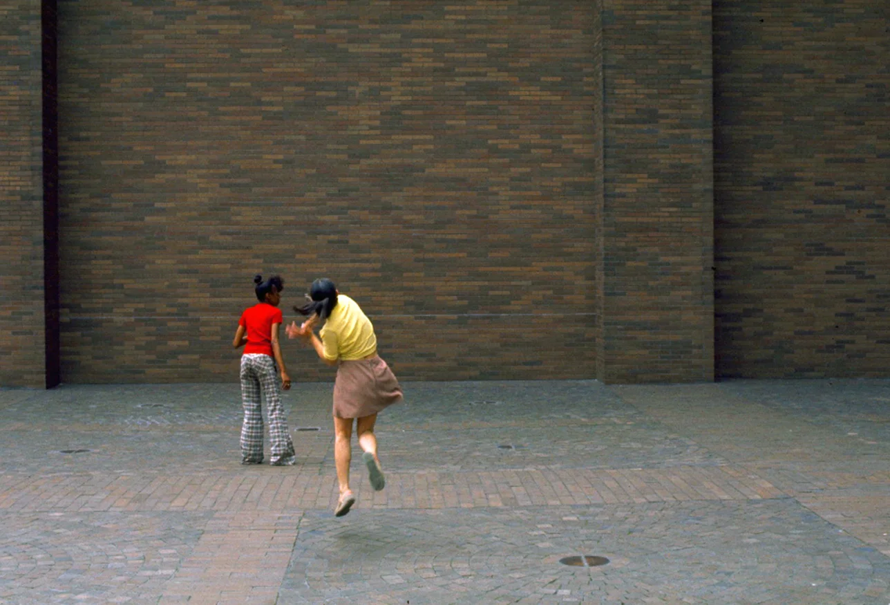 Young girls playing ball. 1970's.
