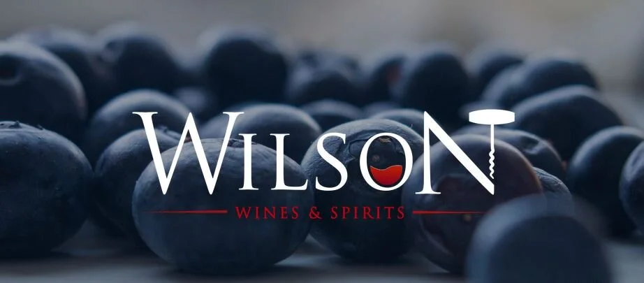 Logo with grapes behind.JPG