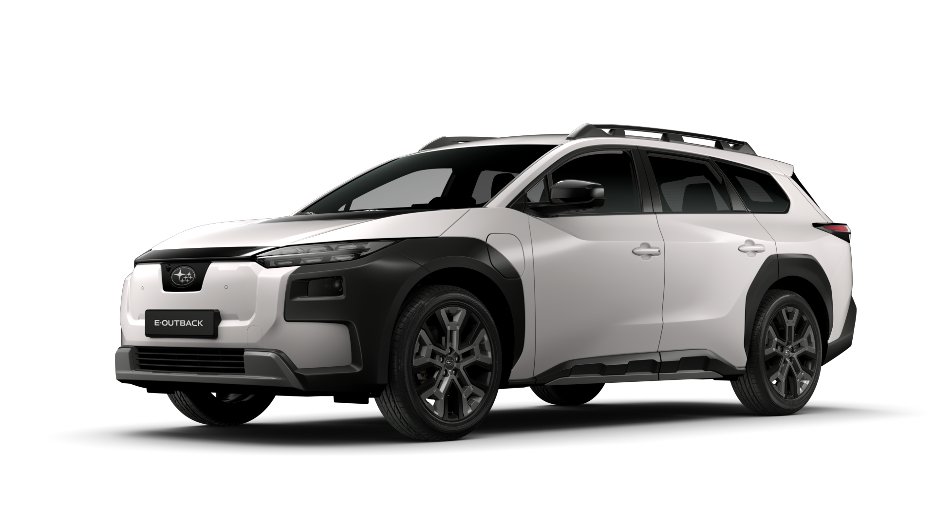 En elektrisk Subaru Outback, to-farget med hvit kropp og svarte detaljer, med takboks og moderne design.