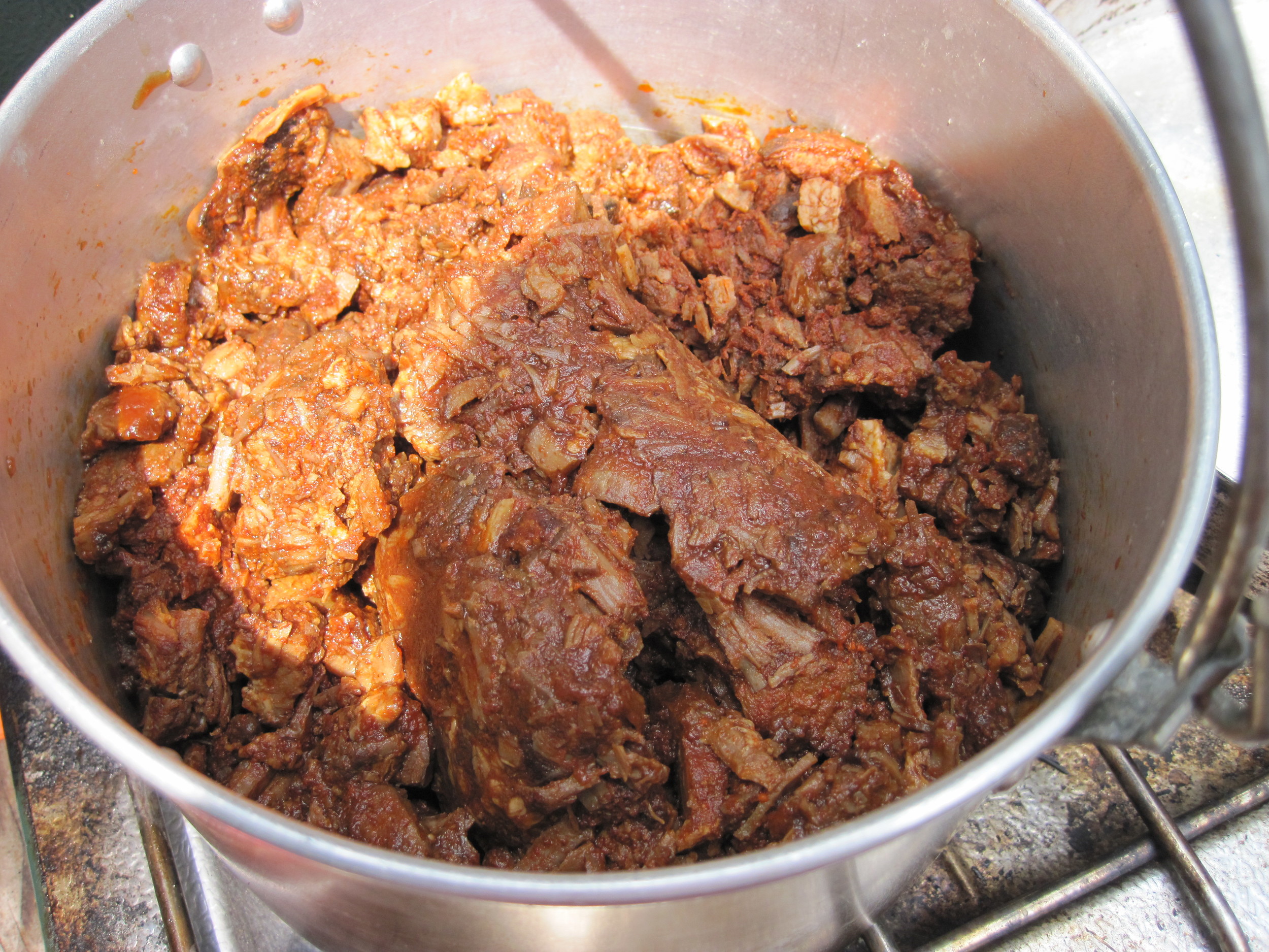 Al pastor taco meat heating up on the camp stove. 