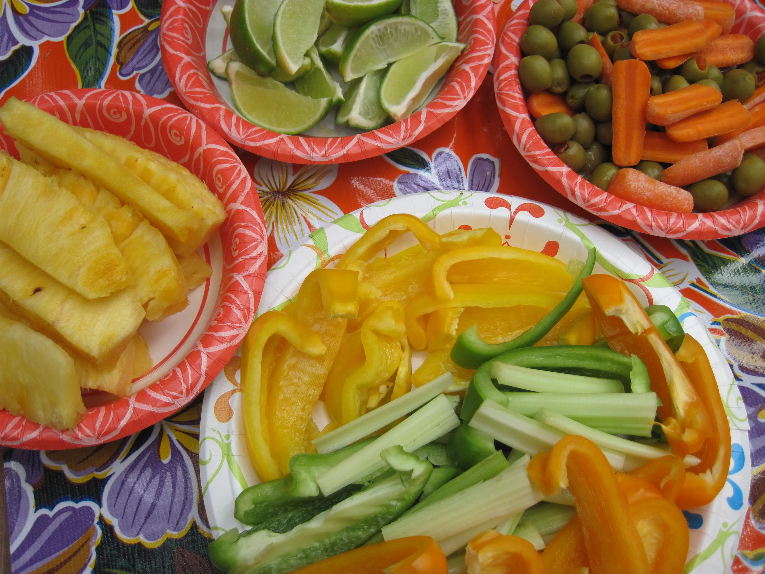 Fresh pineapple and an assortment of veggies & lime slices for the tacos. 