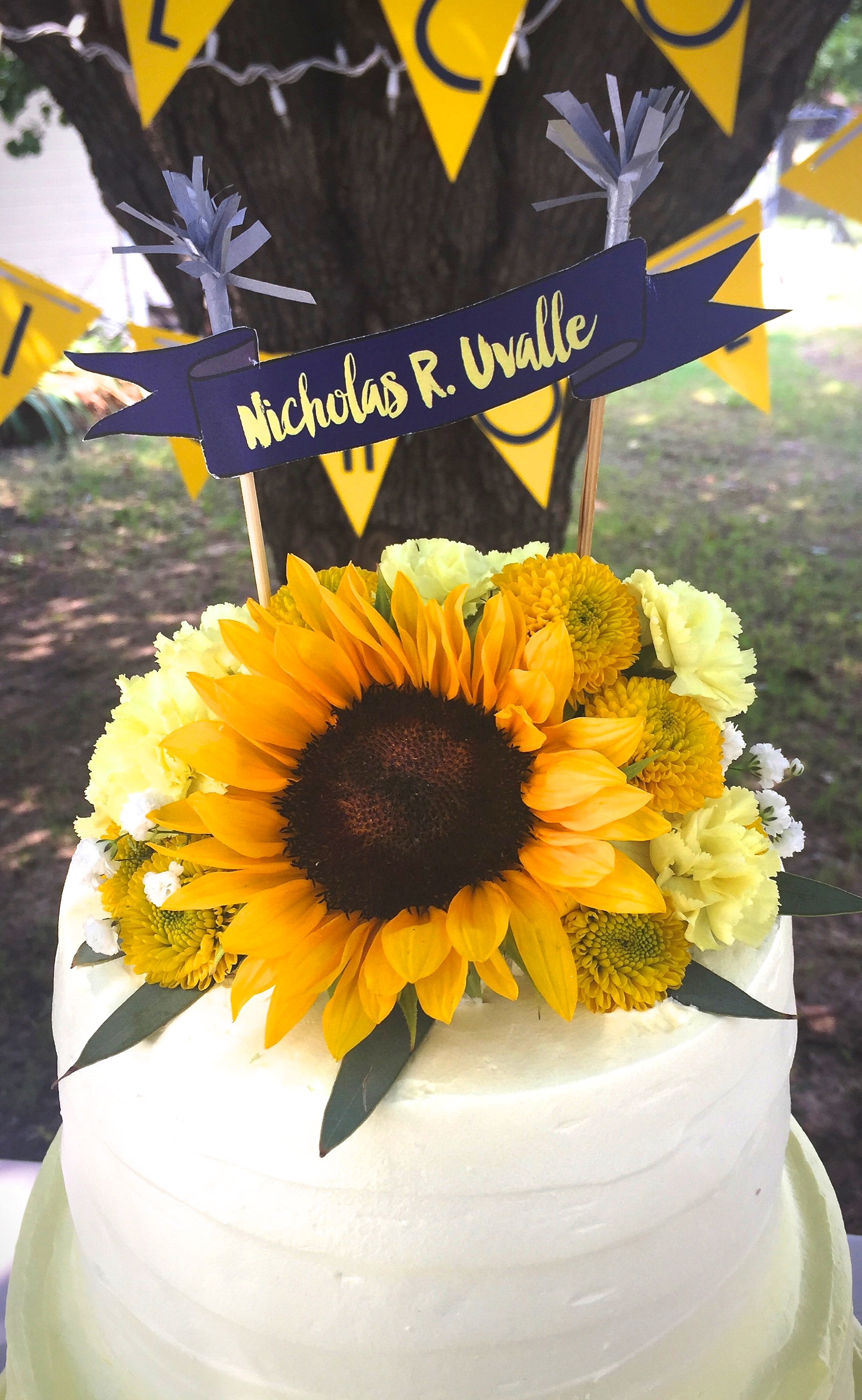 This cake topper & florals adorned Rosalinda's baby shower ombre style cake.