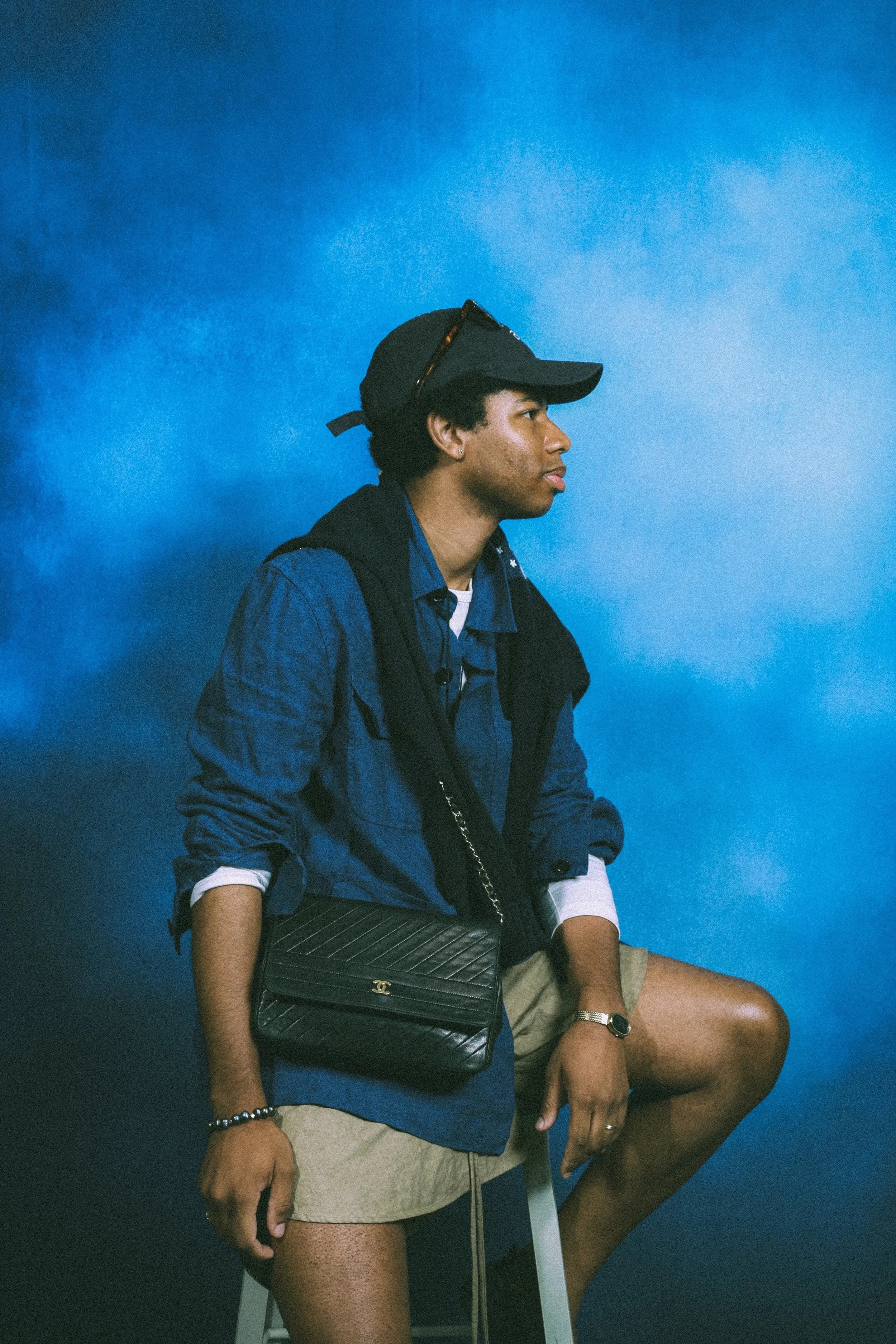 man in blue shirt with coco bag.jpeg