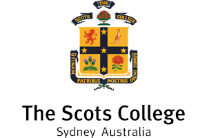 The emblem of The Scots College in Sydney, Australia, featuring a shield with four sections, a lion, a tree, a flower, and a sun, surrounded by a banner with the college's name.