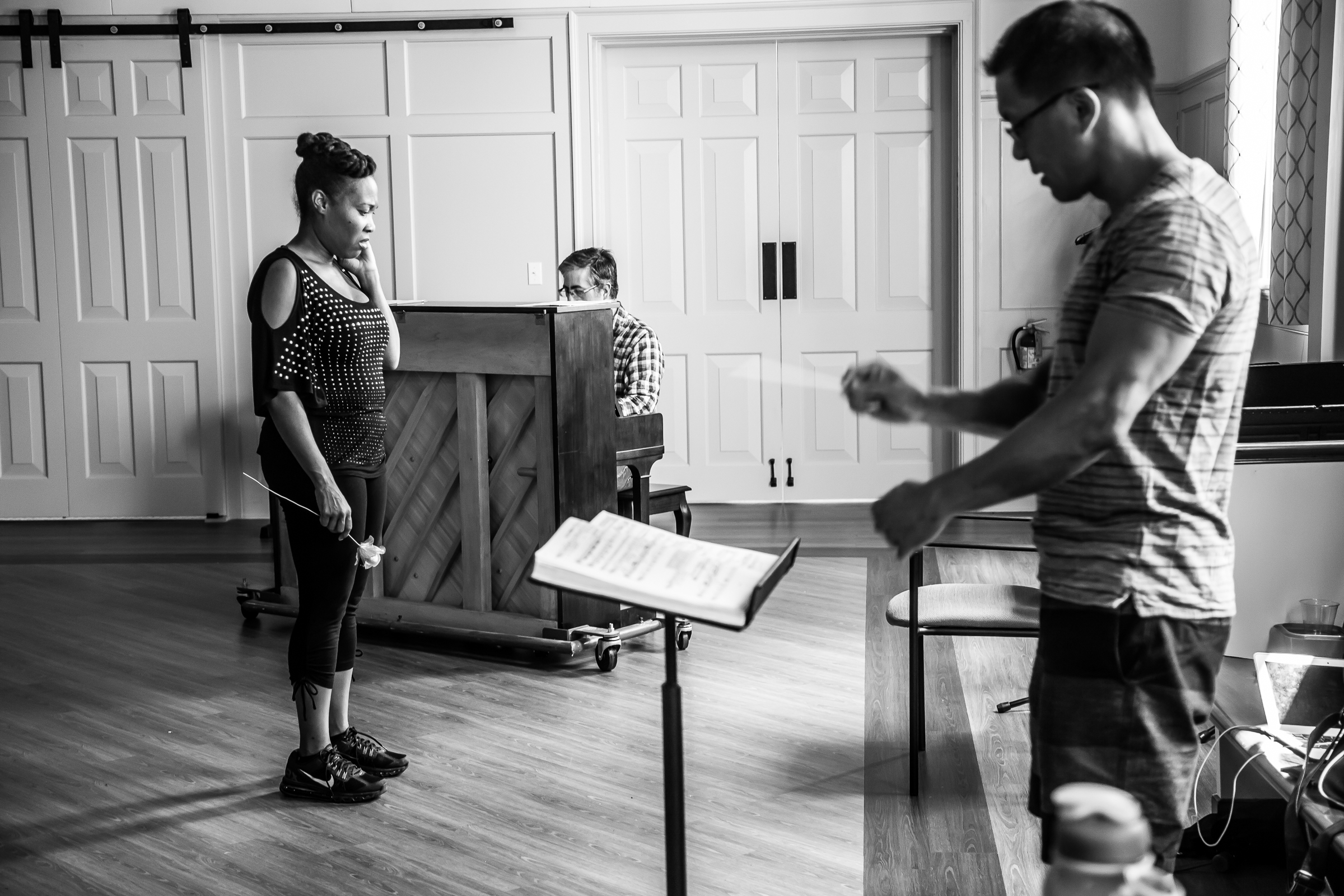 CHARLOTTESVILLE, VA AUGUST 05, 2016 Victory Hall Opera rehearsal of Someone Younger (Der Rosenkavalier) on August 5, 2016.
Pictured from left to right:
Sophie played by Janinah Burnett
Pianist John Mayhood
Composer Conrad Chu
(Photo by Deborah Jaf