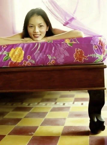 Bao Hoa on bed outside Saigon