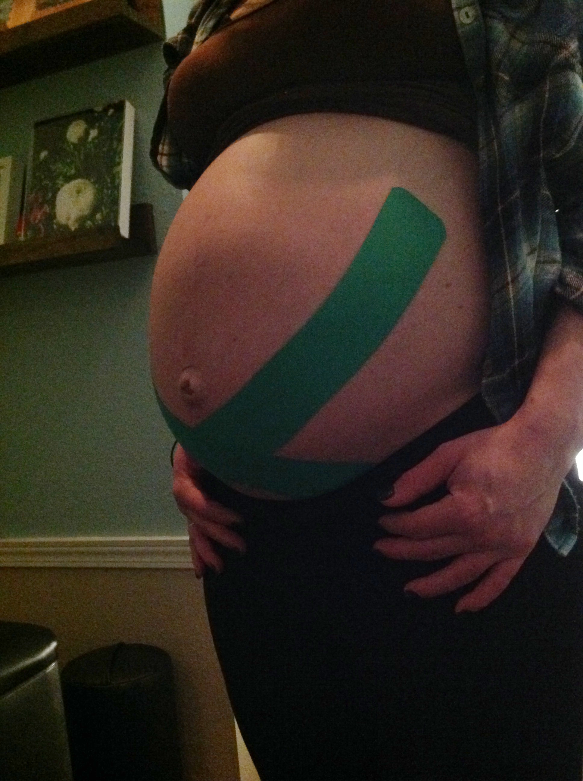 Kinesio Tape to help support this mom's belly