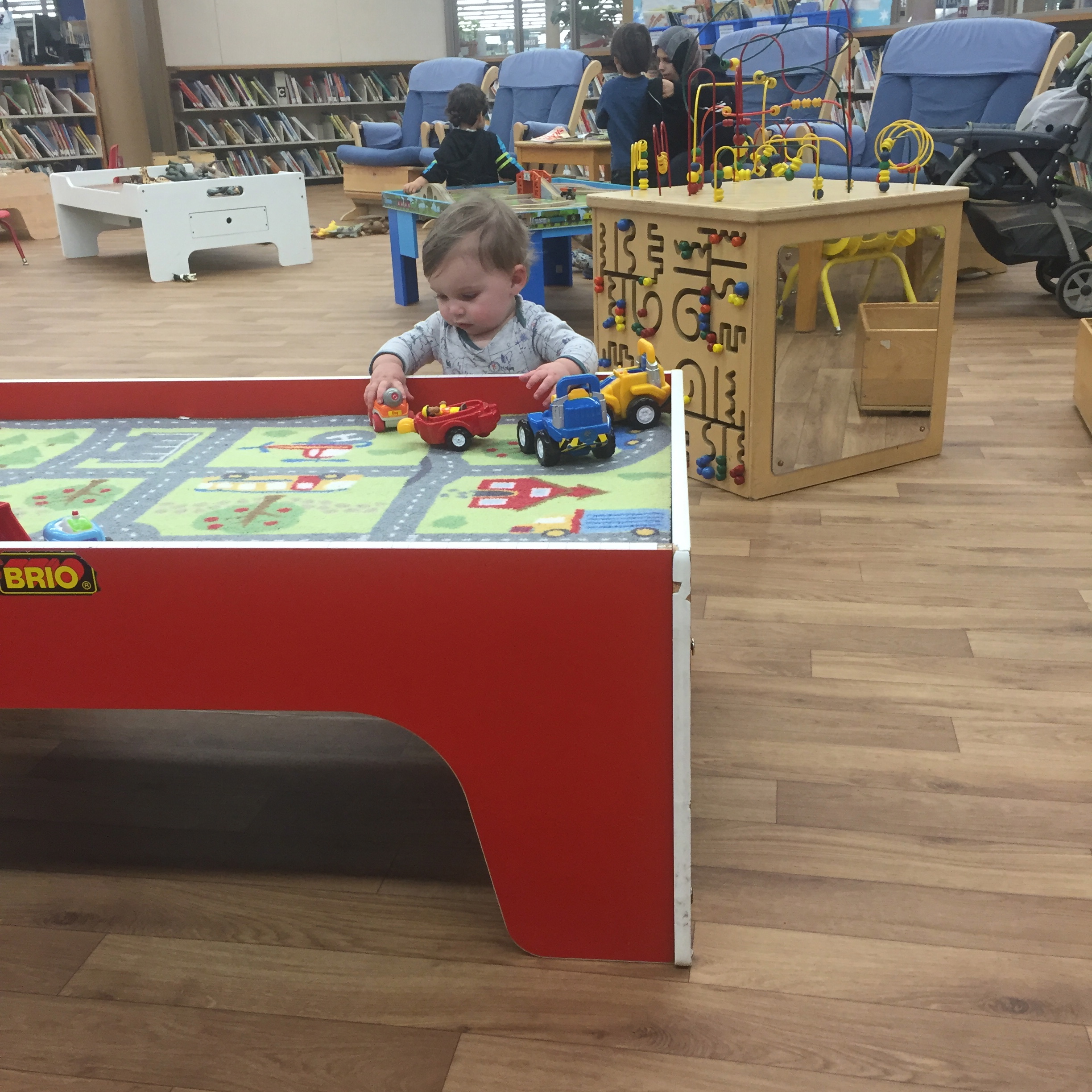  Isaac's first time to the library to play 