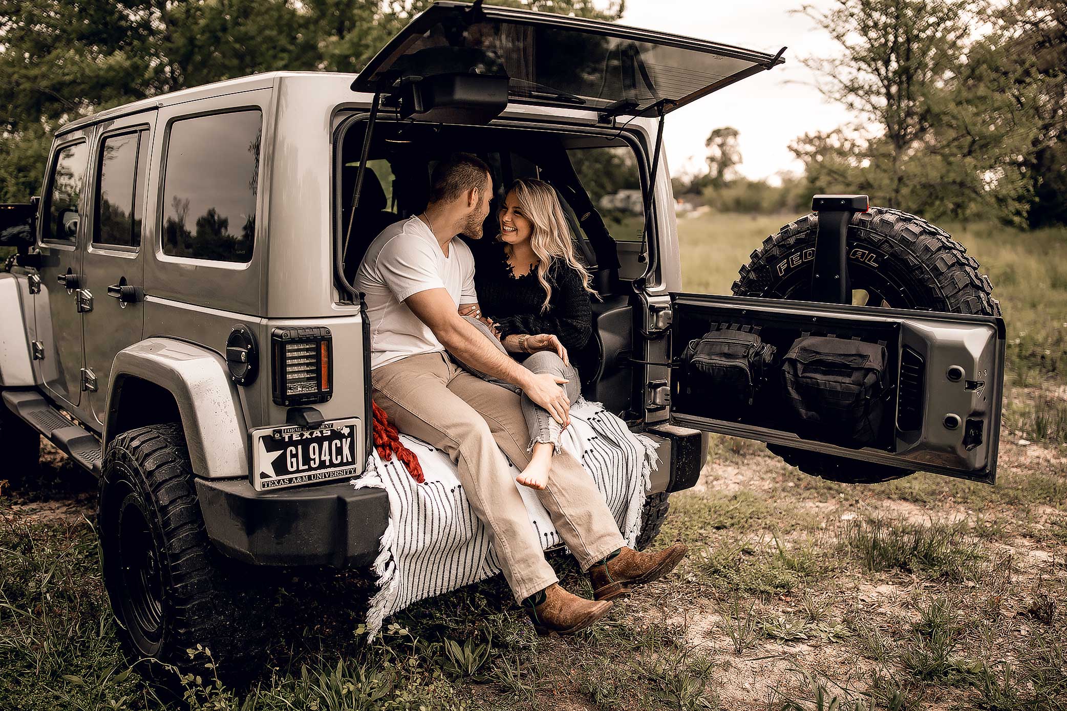 shelby-schiller-photography-lifestyle-couple-sitting-in-jeep-with-boho-pillows.jpg