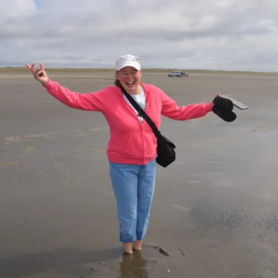 Katrina at play! Sinking in sand literally, but on the solid Rock, spiritually.
