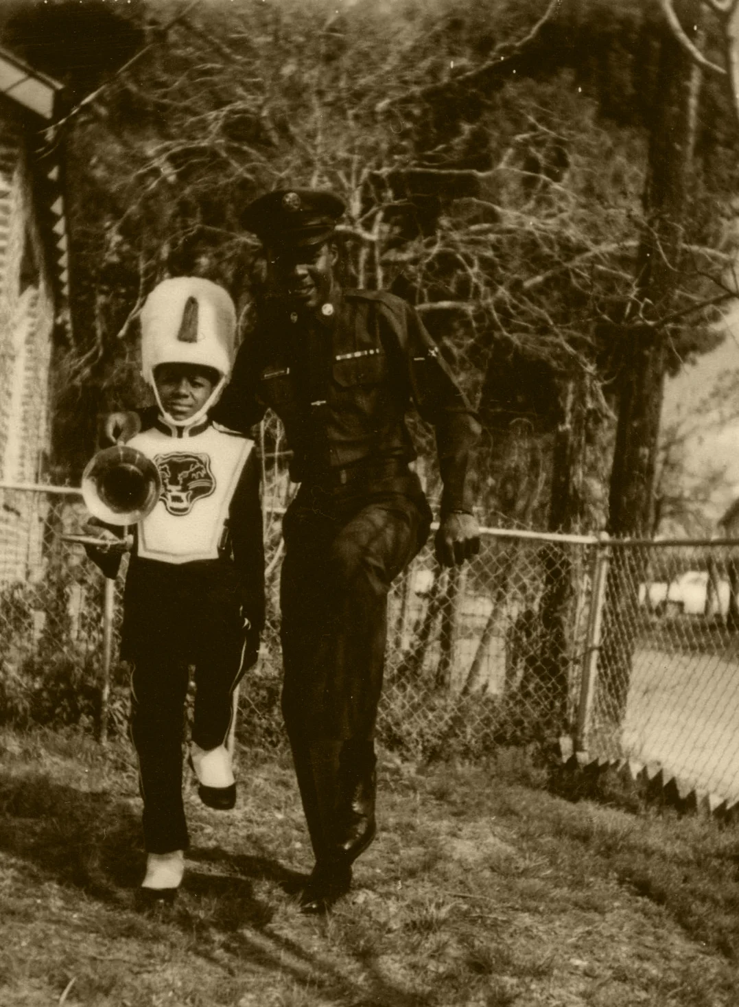 My uncle, trumpeter Donald “Duck” Washington in military uniform posing with my older brother Ernest “Tammy” Thomas Jr. holding his trombone.