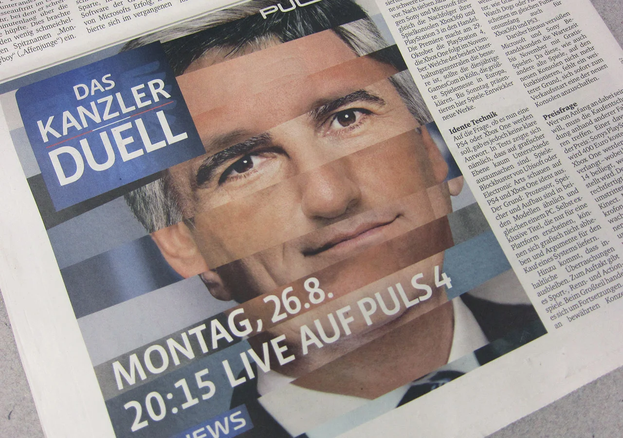 PULS4_Wahl2013_Kanzlerduell_Zeitung_1.jpg
