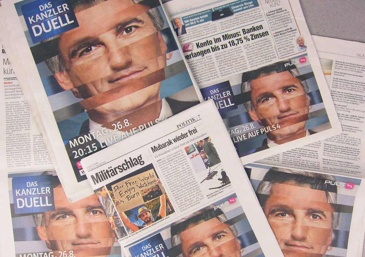 PULS4_Wahl2013_Kanzlerduell_Zeitung_3.jpg