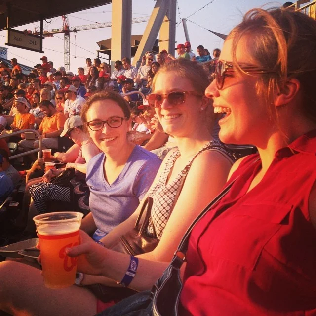 Left to right: Jenny; Jenny’s wife, Kate; and Christa (previously featured in our “Where Are They Now?” series) at a Nationals baseball game with the NVRDC case management team in July 2014.