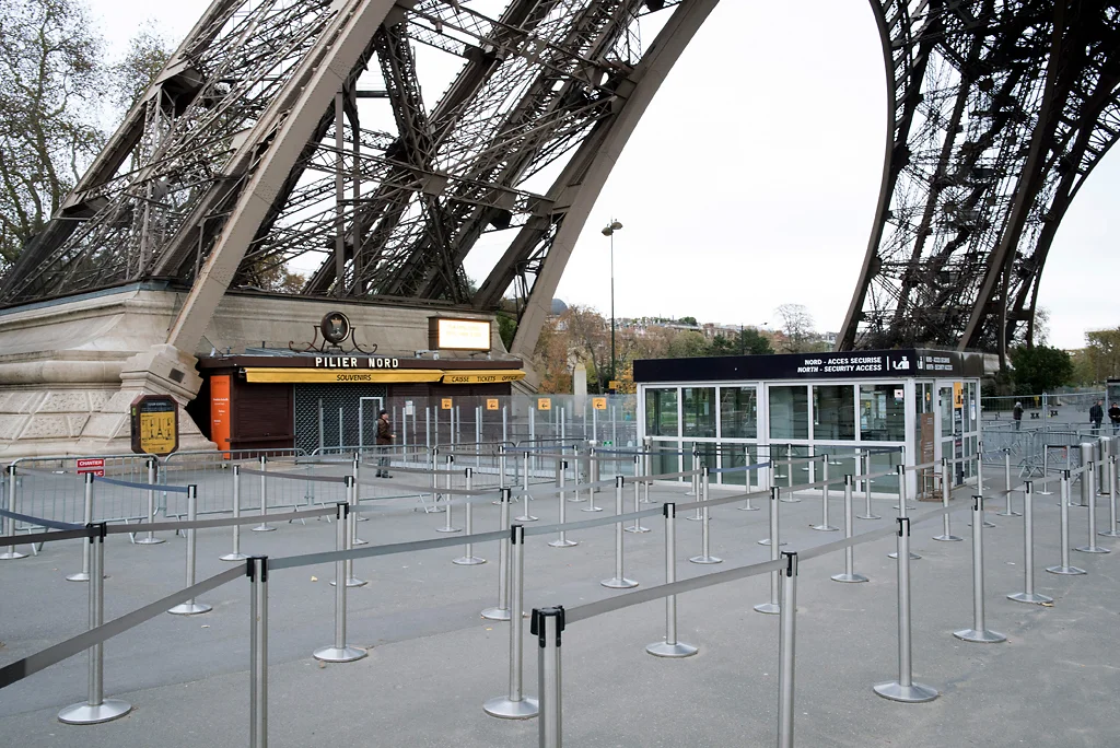 No queues, closed ticket offices and souvenirs shops are seen at the Eiffel Tower in Paris, France, Saturday, Nov. 14, 2015. French President Francois Hollande vowed to attack the Islamic State group without mercy as the jihadist group claimed responsibility Saturday for orchestrating the deadliest attacks on France since World War II. Photo by Kamil Zihnioglu/AP