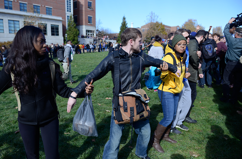  People form a human chain trying to keep media out after Jonathan Butler's hunger strike was brought to an end Monday morning as UM System President Tim Wolfe officially resigned Nov. 9, 2015.  Photo by Justin L. Stewart/Missourian 
