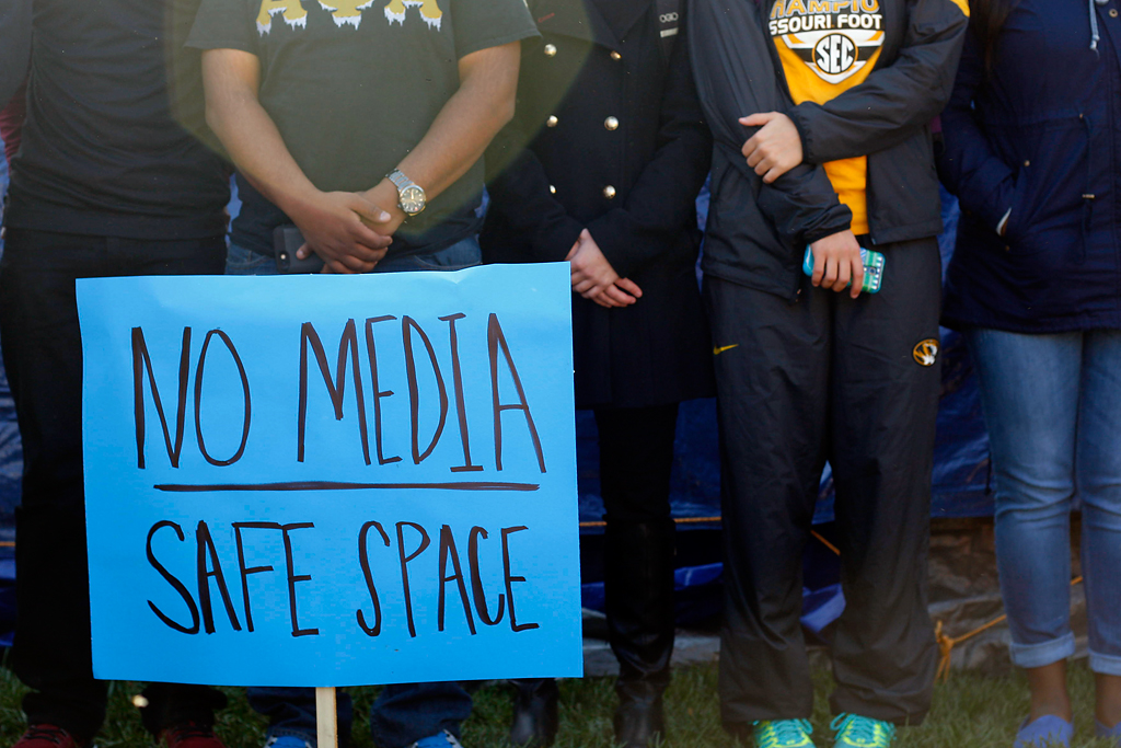  Students from the Concerned Student 1950 group and supporters of their movement rally together and link arms around the tents at Carnahan Quad following the announcement of UM System President Tim Wolfe's resignation, Monday, Nov. 9, 2015. Tears, hu