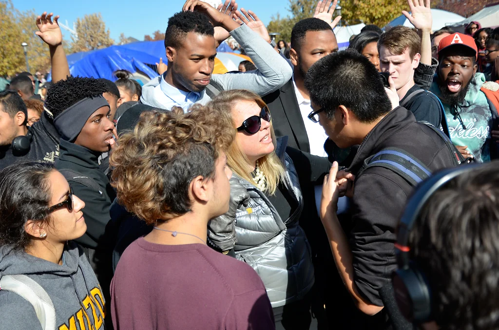 Greek Life & Leadership Assistant Director Janna Basler tells freelance photographer Tim Tai that he needs to leave and was not allowed to take any more photos Monday, Nov. 9, 2015. Many Concerned Student 1950 members said the media was being disrespectful, and that they were ruining their reputations as journalists. Photo by Halee Rock/Missourian