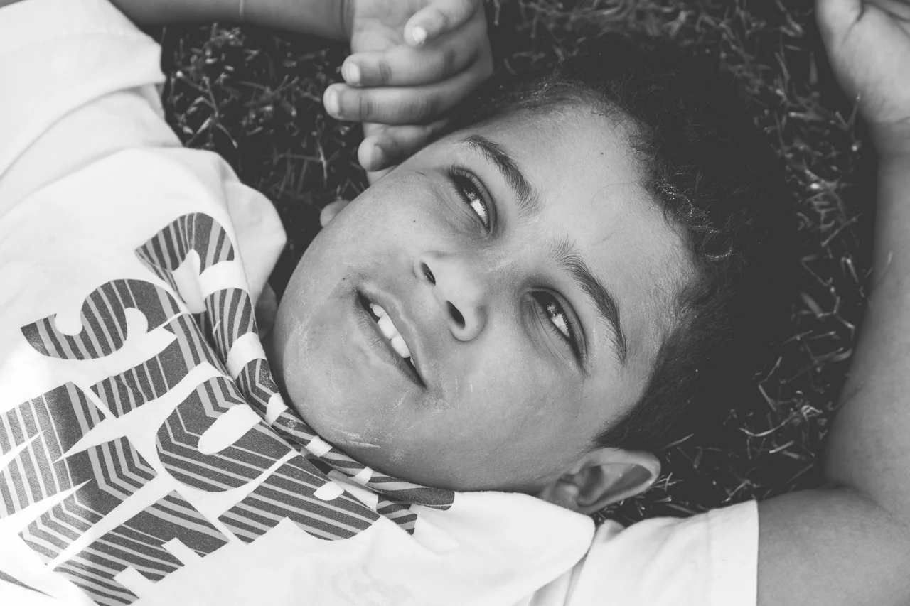 New Jersey Family Photographer - Boy Smiling In Grass