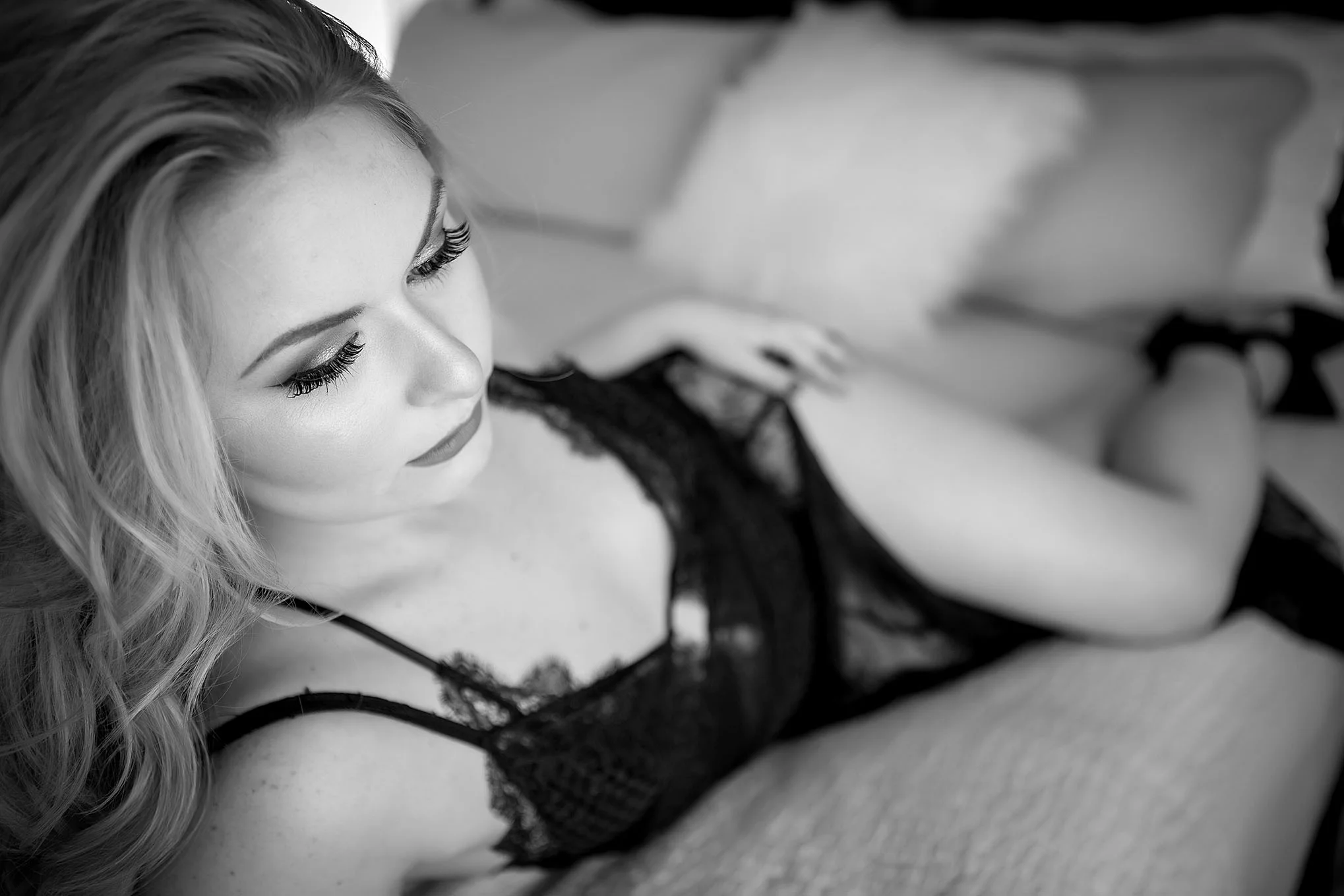 "I did my shoot as a surprise gift for my fiance on our wedding day and let me tell you this was the best gift ever! I'll start by saying Mandy is an amazing photographer, she captures a story not a pose. When we first talked about what I wanted for my photos she helped me get ideas of what to wear which is the biggest part in my opinion, if you don't feel confident in the two pieces of fabric covering your girly parts you kinda have a problem. On the day of the shoot I went to her studio and had my hair/makeup done and just hung out with her and the MUA. It was such a fun experience that really just felt like girl time. When the shoot started I wasn't nervous just more worried I would look awkward or out of place in the photos, as the shoot went on it started to feel more natural and it was honestly so much fun. I guess you never really know how you will feel wearing lingerie in front of someone you barely know until you are doing it for a few hours. It was such a good experience and of course my fiance loved it. He was so shocked when he looked at the album...mission accomplished."