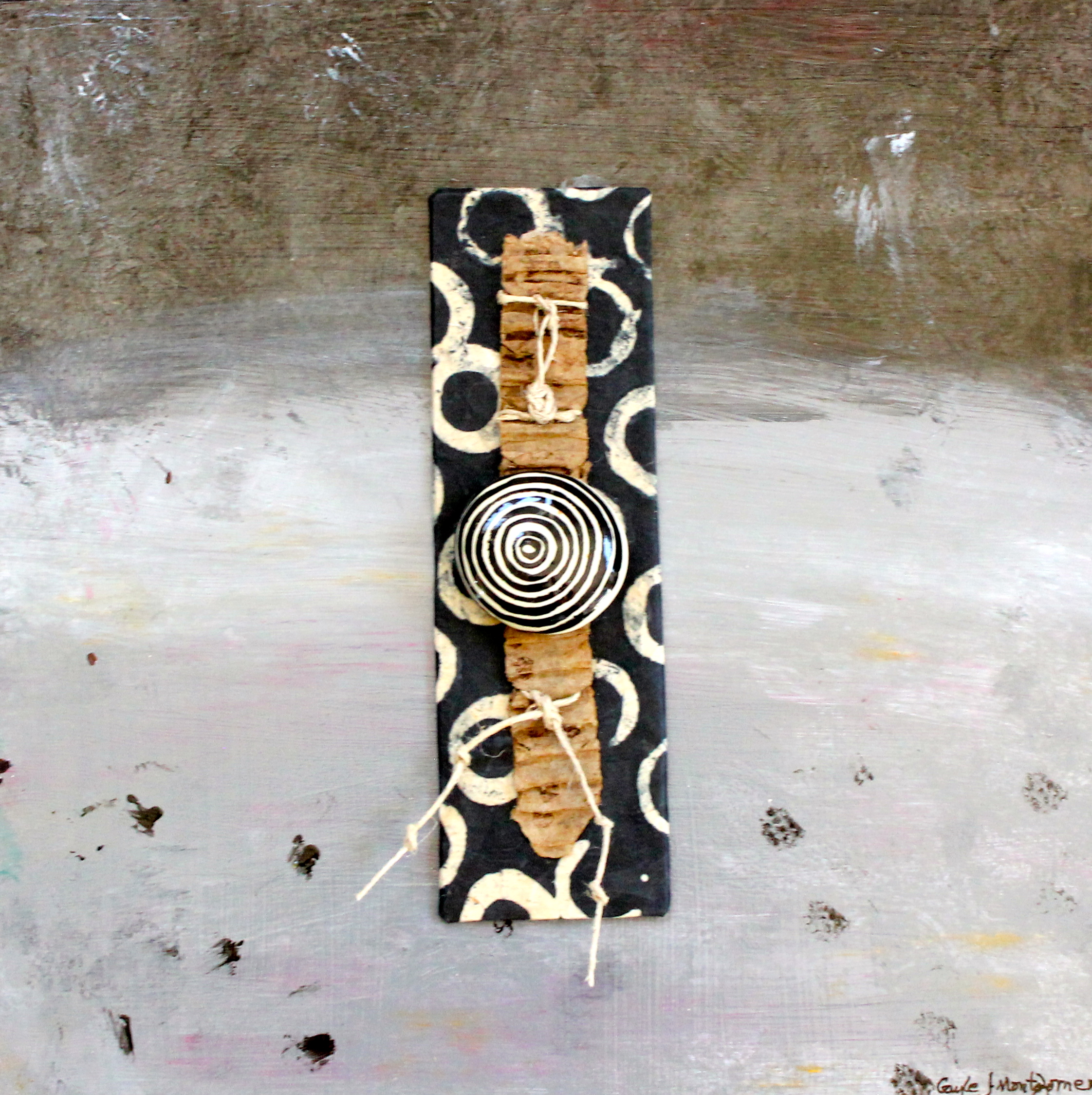 "Circles of Life" Materials used: Paper ephemera, clay piece, cord on acrylic painted museum board