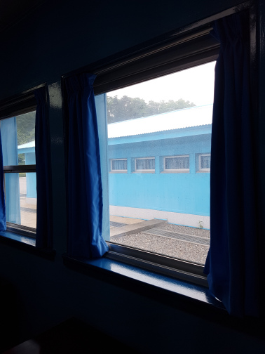 The 38th parallel is marked by that concrete slab you see through the window. This photo was taken while I was, technically, on the North Korean side of the DMZ. 