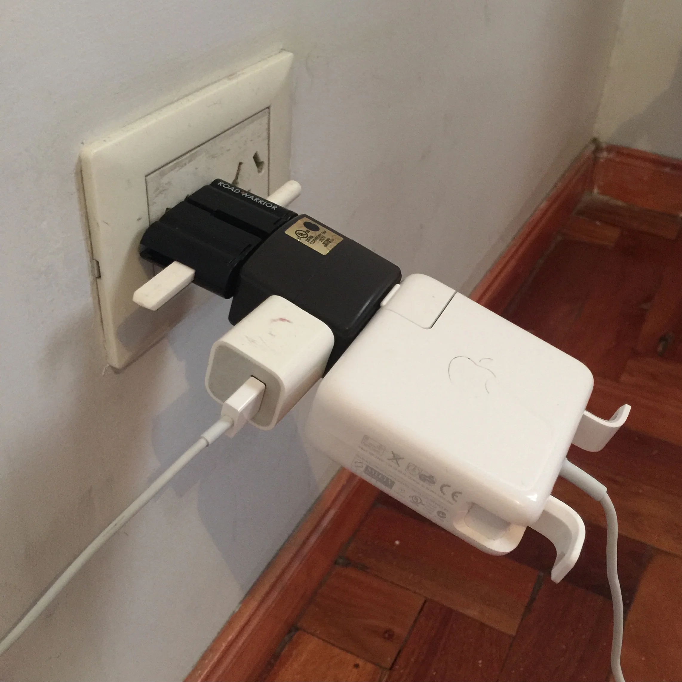 Ah my favorite thing about hostels and cheap hotels. I travel with a roll of grip tape in case it's the only way to securely fasten the damn adapter into the wall. 