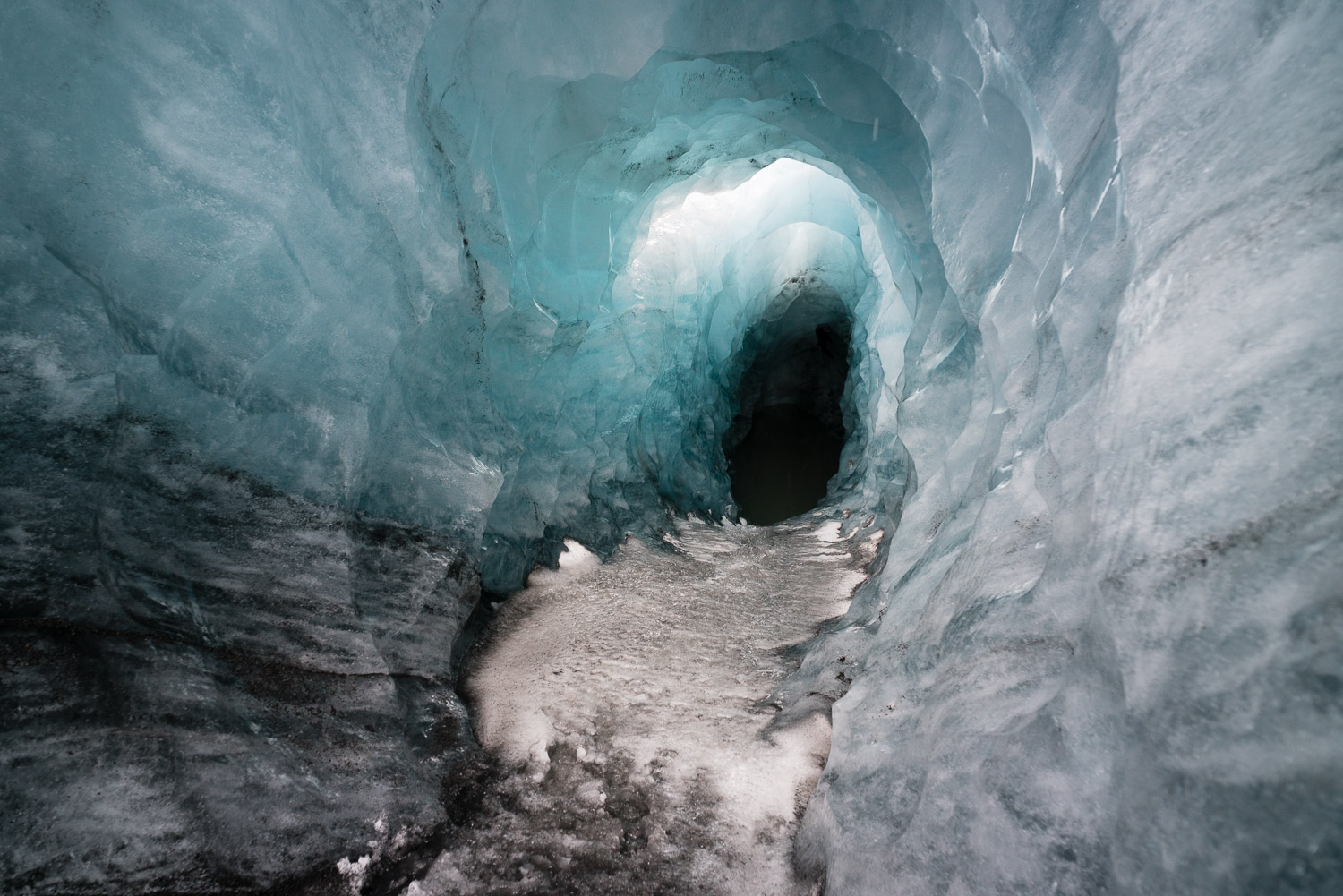 A fresh meltwater tunnel in Sólheimajökull glacier. How deep is it and where does it go? Who knows. 95% of the world’s glaciers are retreating, Iceland’s no exception. Here, unseasonable meltwater bore a tunnel through solid ice in less than a week. As always for me, reading about problems like this is just a piece of the endless stream of troubling information we receive on a daily basis. Seeing it, touching it, walking in it, hearing first-hand stories about it, always puts it into a more meaningful, lasting context. 