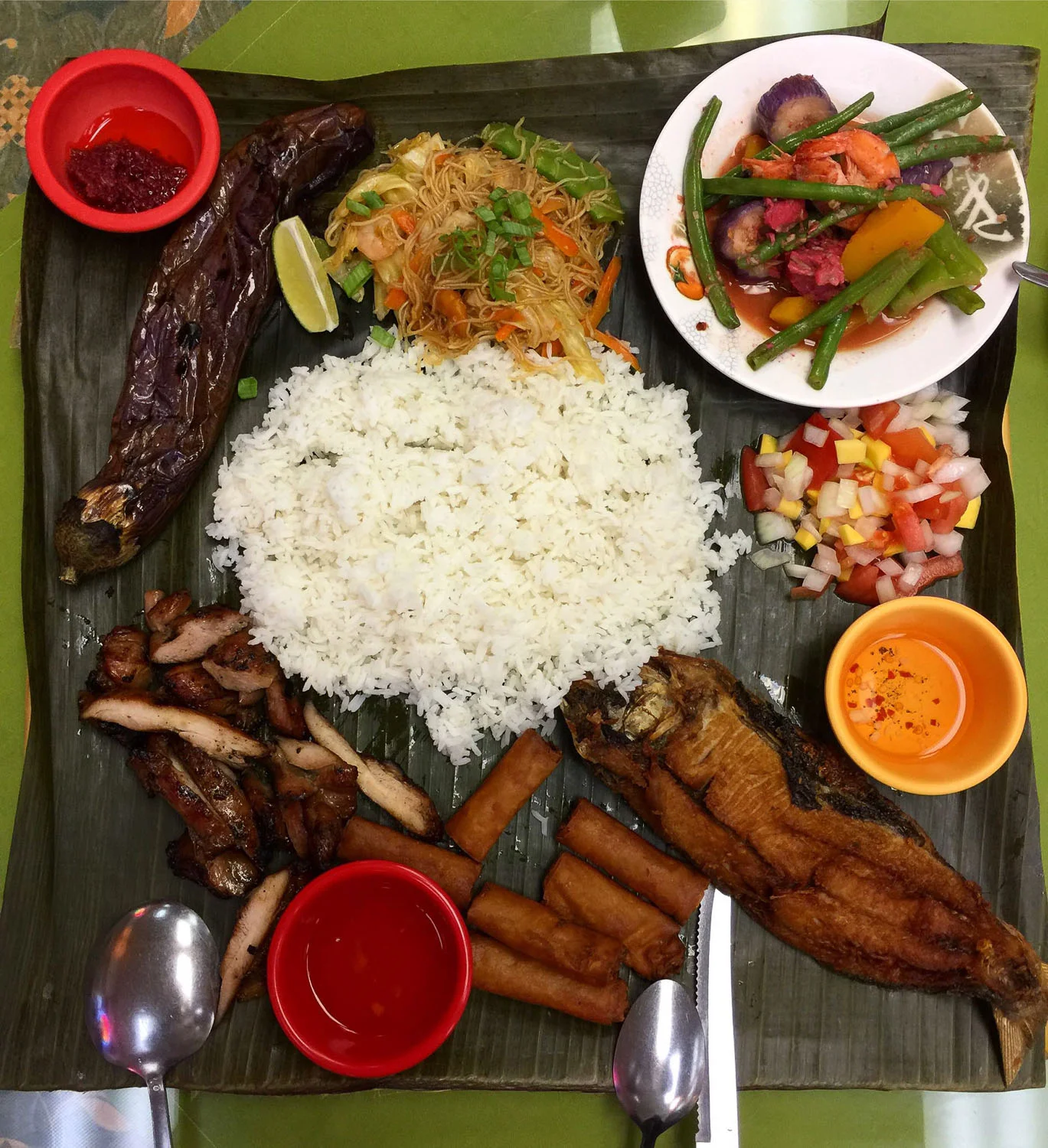 Ihawan's banana leaf feast for two. Pork BBQ, milkfish, grilled eggplant, shanghai noodles, spring rolls and more. Grab a handful and shove it in your face!