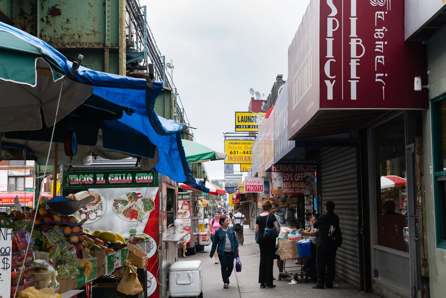 A taco cart next to a Chinese fruit stand next to a Tibetan restaurant next to a Colombian bakery. Welcome to Jackson Heights.