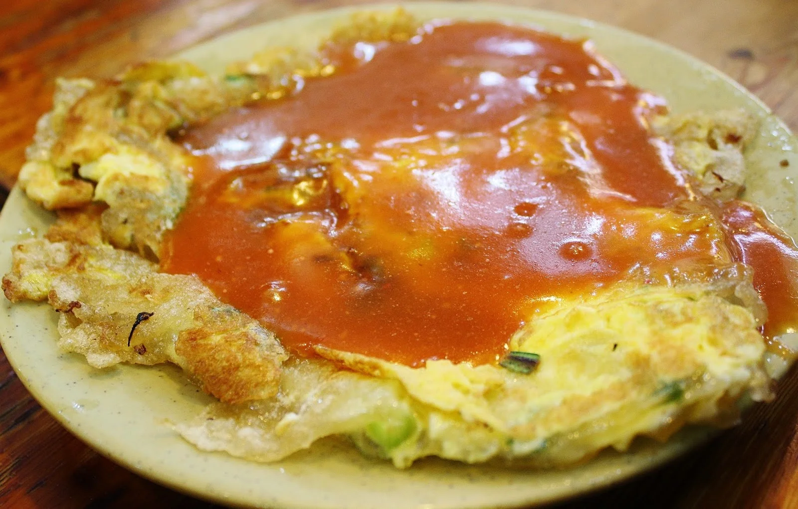 Famous Taiwanese oyster omelete aka "oyster pancake" Made with potato starch and really chewy and delicious. Google Images.