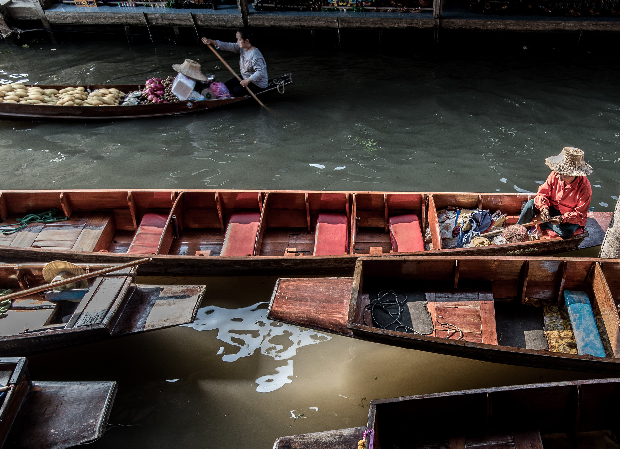 Floating Market Man in empty boat.jpg