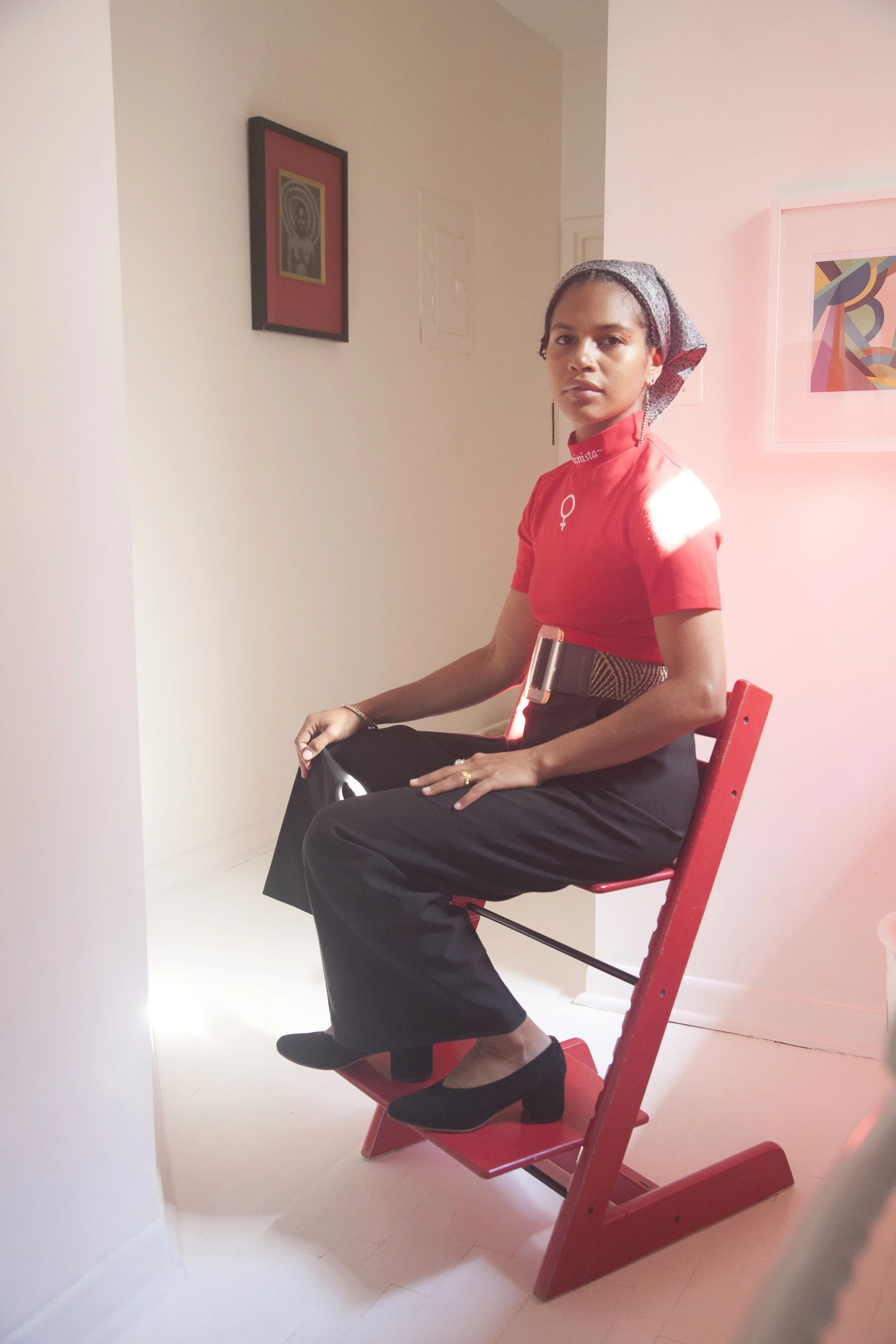 Mengly seated in Belu Pump in Red Chair.jpg
