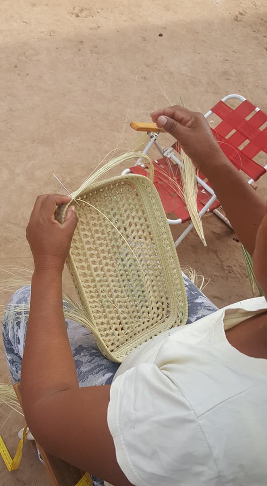 A Pilagà woman weaves a carandillo tray using techniques passed down from elders.