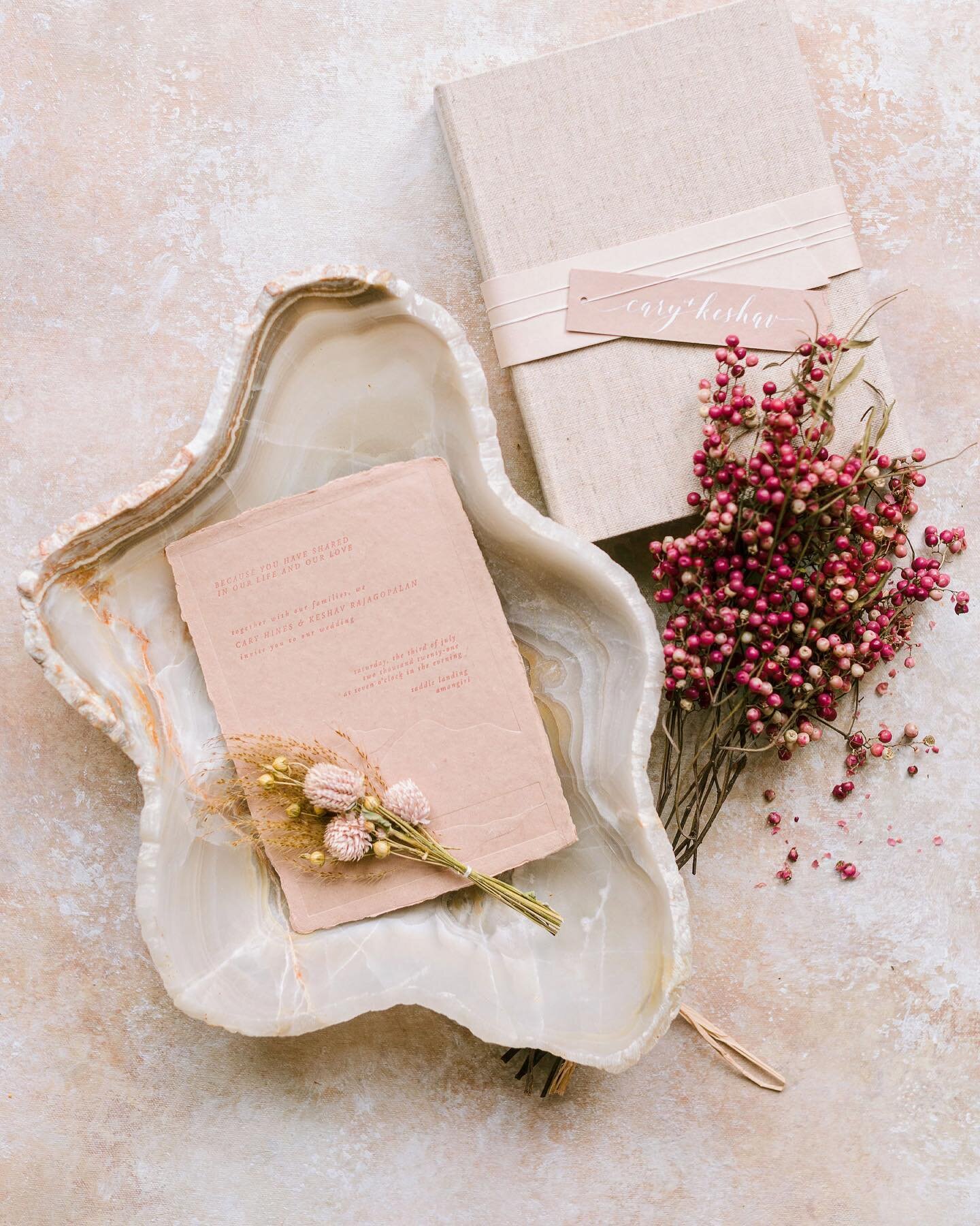 Instead of mailing out invitations beforehand, C&amp;K opted for boxed invites left as a turndown gift in guest rooms then night before their wedding day. Each box featured a floral arrangement, letterpress invitation, and their favorite photos with 