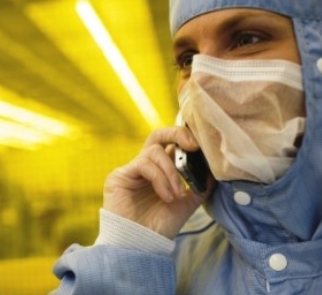Staff, working in the clean room has to wear special protective cloths: heads, face masks, gloves, boots and cover-alls