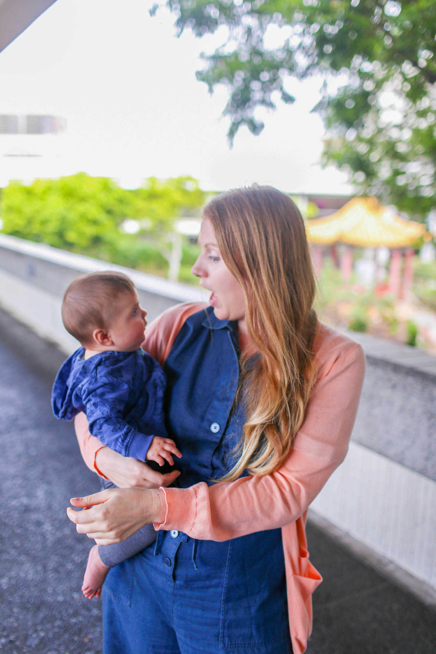 Goofy mommy with baby Scout after a long flight to Oahu, Hawaii.