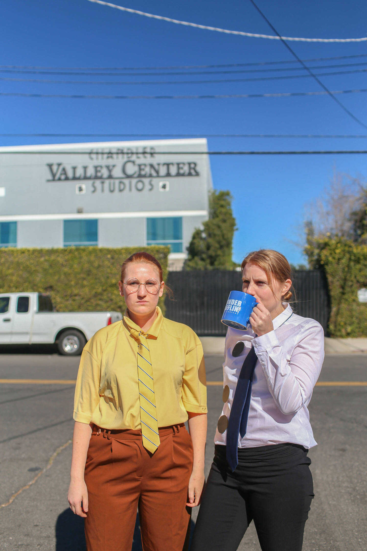 Kara dressed as Dwight Schrute and me dressed as Jim Halpert in front of the Dunder Mifflin office building in Panorama City.