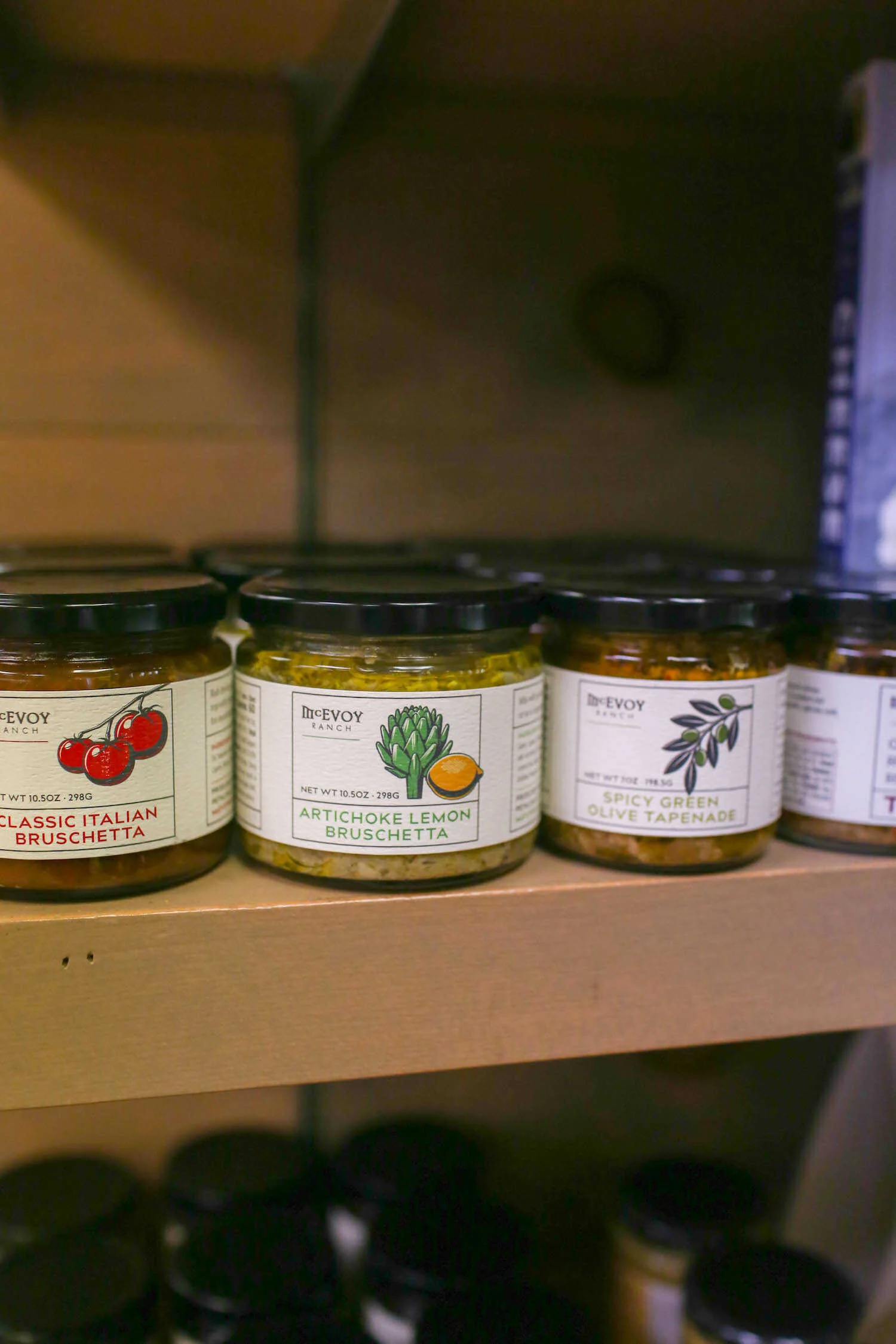 Gennifer Rose - Dog-Friendly Picnic at Marin French Cheese Company in Petaluma - Locally made McEvoy Ranch Spreads for sale inside the store.