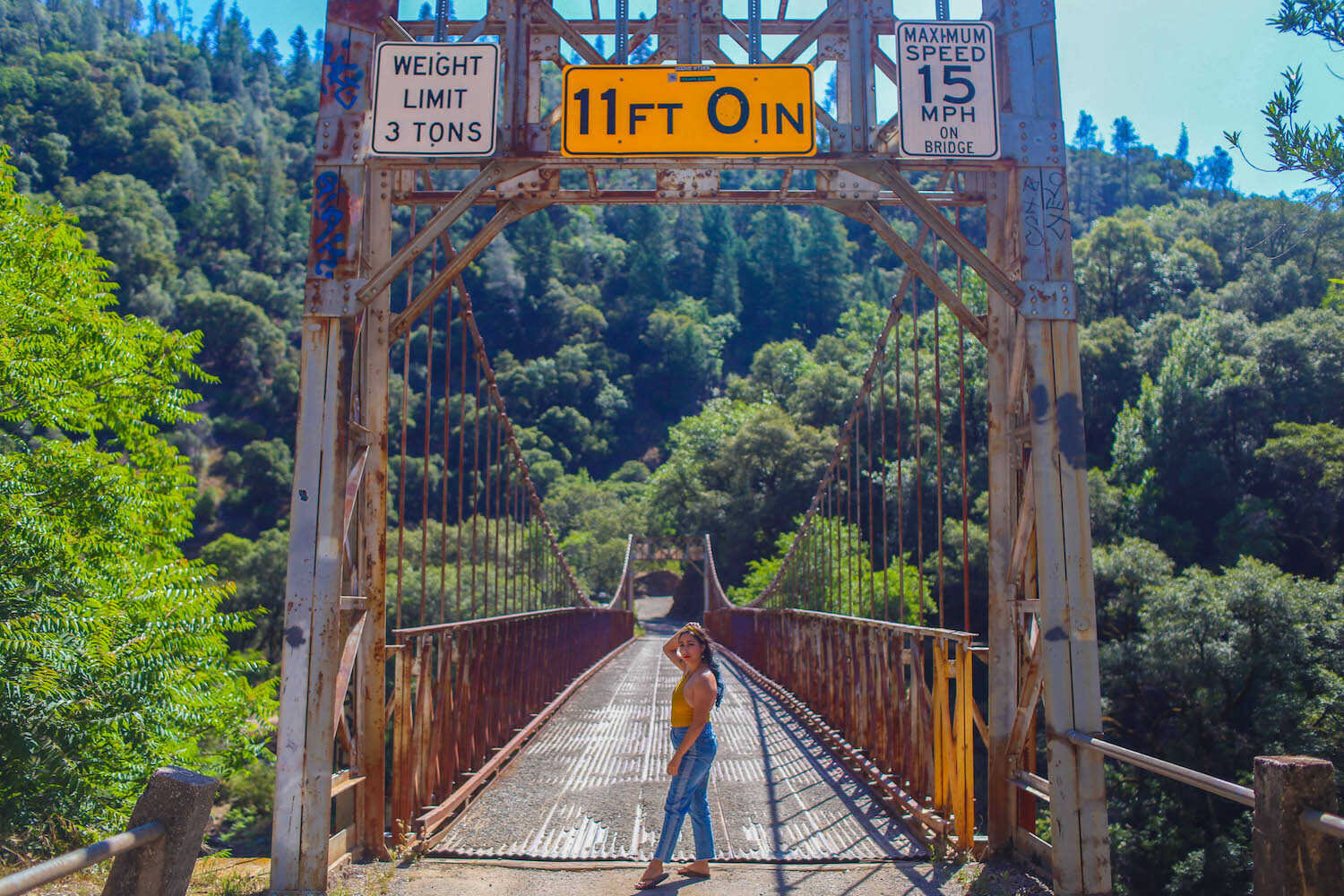 Walking across Yankee Jims Suspension Bridge.