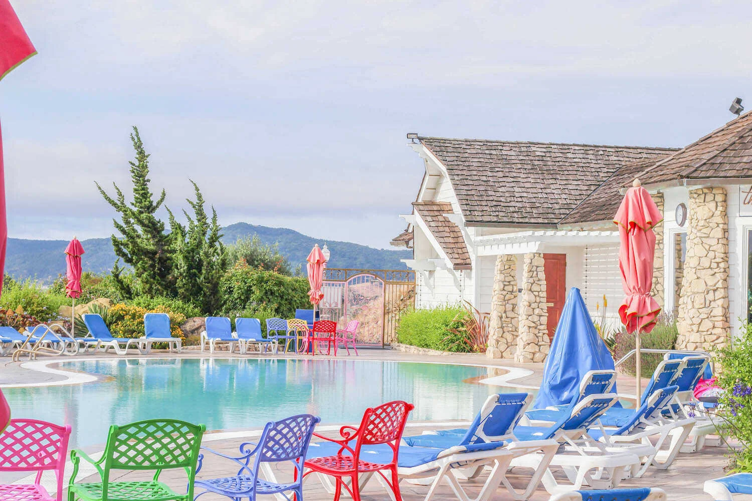 Hotel pool deck and colorful patio furniture at the Madonna Inn.