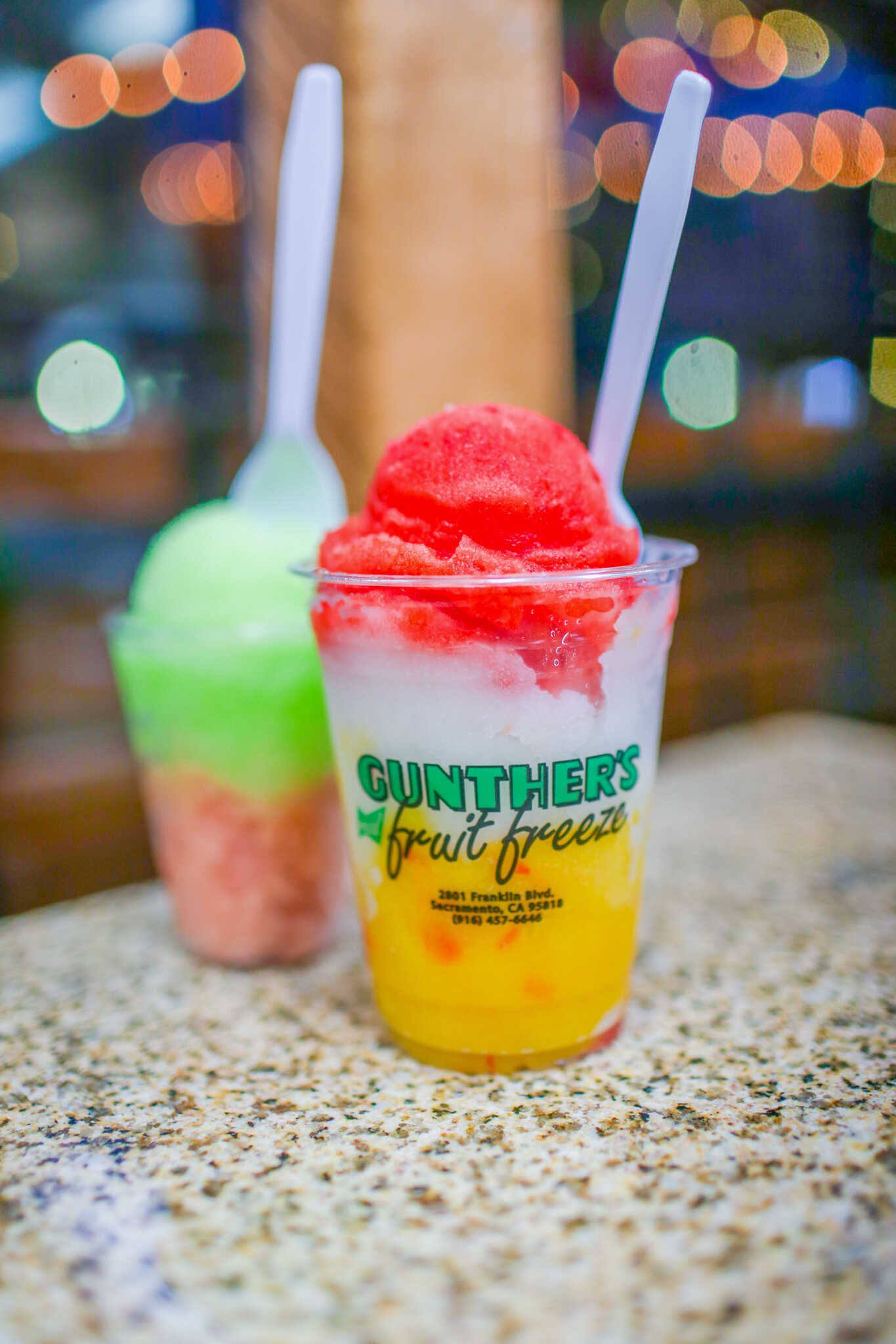 Family Travel Guide to Folsom California - Gunther’s Fruit Freeze from Snooks Candies and Chocolate Factory on Sutter St in the Folsom Historic District.