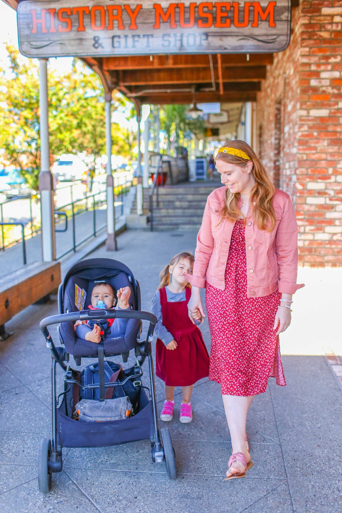 Family Travel Guide to Folsom California - Family stroller walks down the Folsom Historic District on Sutter Street.