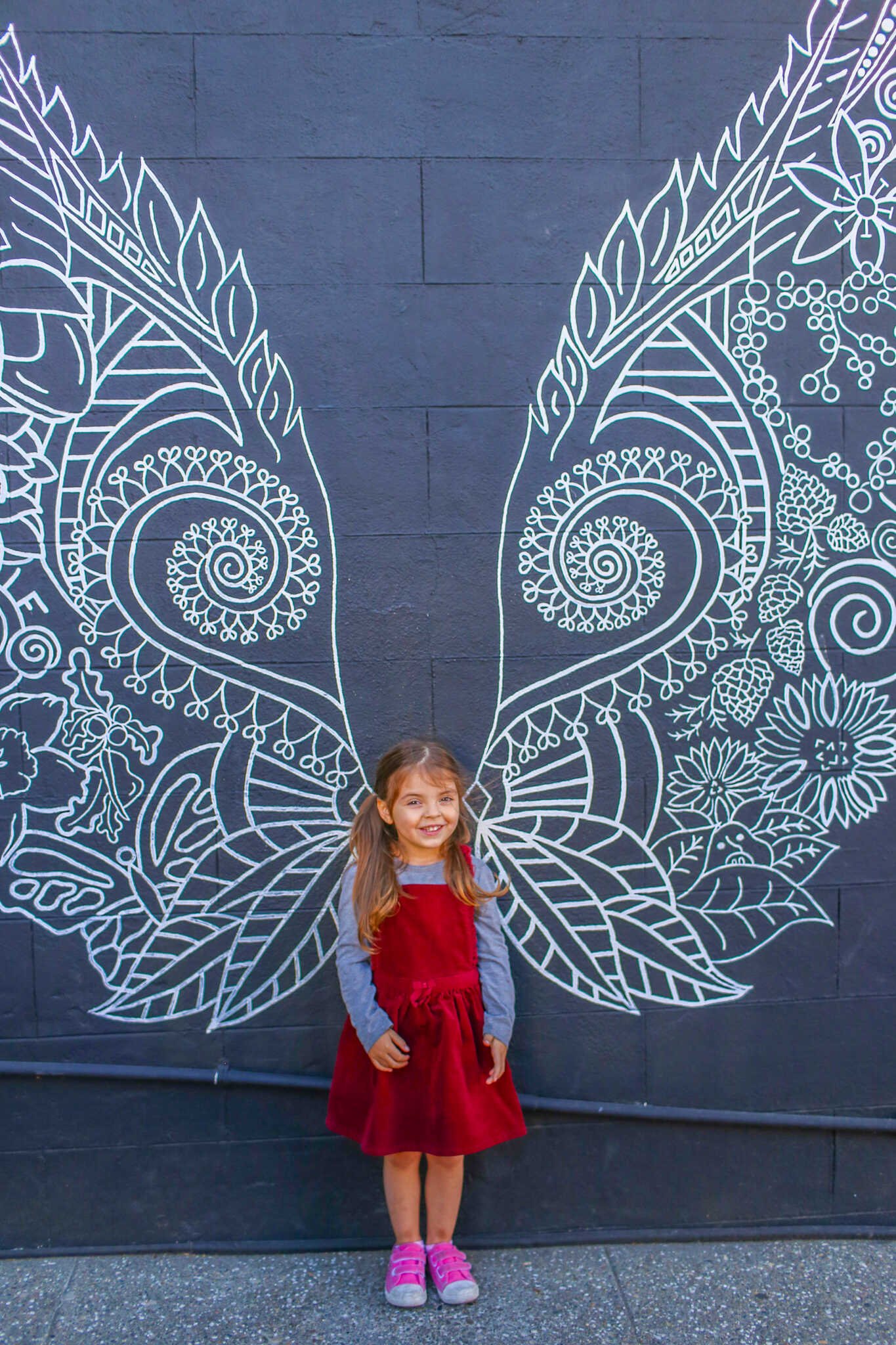 Family Travel Guide to Folsom California - Angel wings mural on Sutter Street in the  Folsom Historic District.