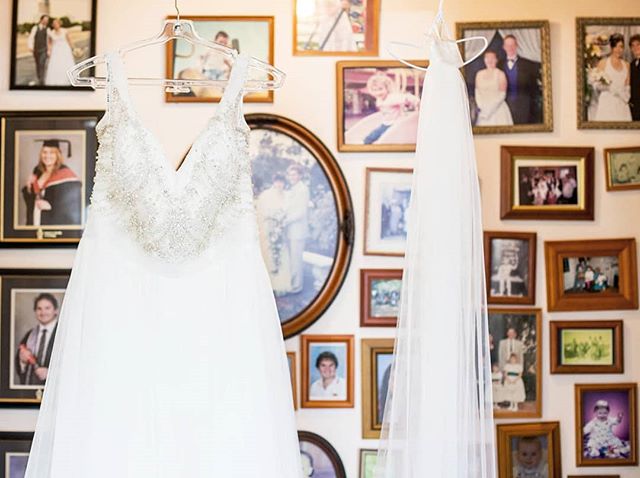 The moment I walked into Alanna's parents house and saw her dress hanging in-front of a family photo wall it was my favourite spot in the house! 
So many generations of photo's, achievements and memories. My favourite being her parents wedding photo 
