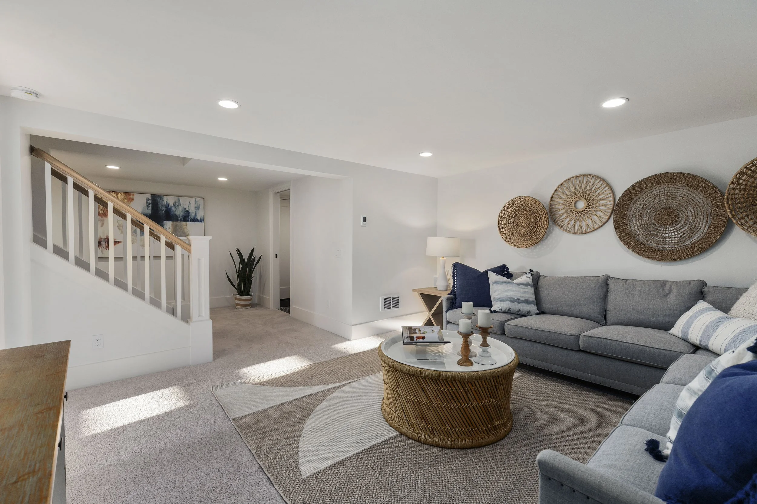 Finished Lower Level Created Through Stair Reconfiguration