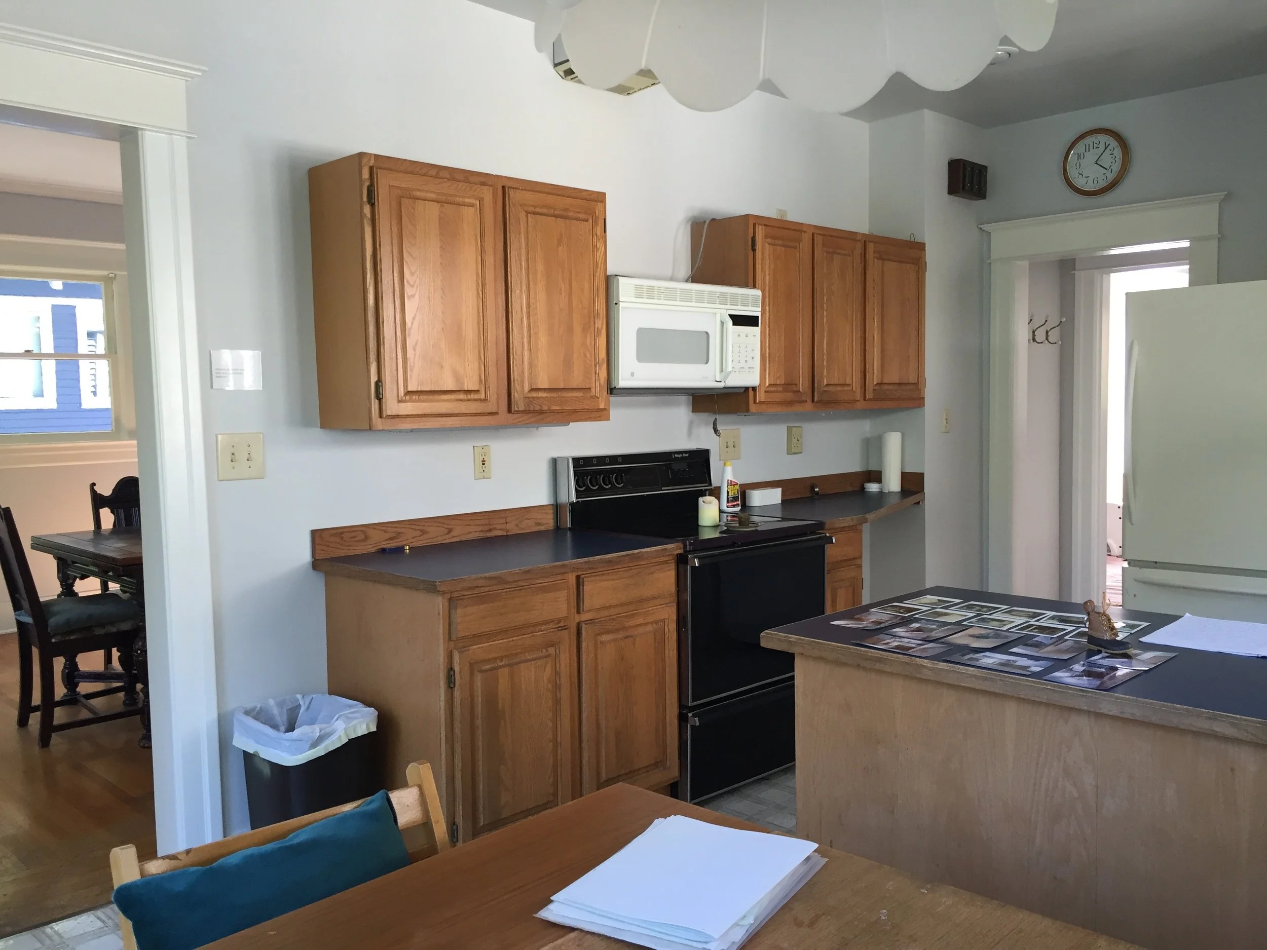 Kitchen/dining — before: Original enclosed kitchen and dining room before wall removal